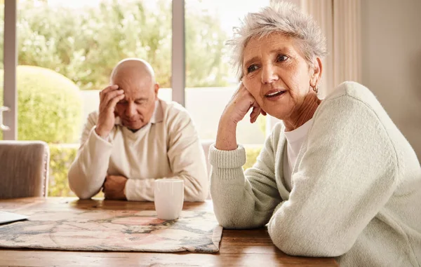 Senior couple, divorce and stress with fight, depression and breakup in living room, angry and financial crisis. Old man, mature woman or toxic relationship with anger, sad or mental health in lounge.