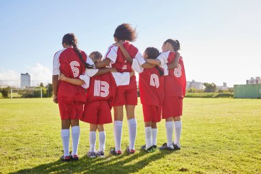 Diversity, sports girl and soccer field training for youth competition match playing at stadium grass. Young athlete, standing or player enjoy football teamwork or support world cup championship game.