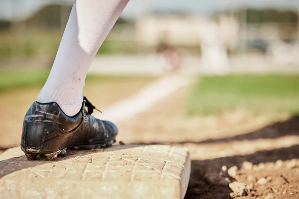 Sports, baseball and plate with shoe of man on field for training, fitness or home run practice. Workout, games and pitching with athlete playing at park stadium event for tournament, match or action.