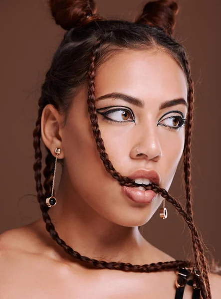 Makeup, grunge and black woman in studio with gen z aesthetic, punk and rocker on brown background. Fashion, edgy and cool girl posing, creative and confident with contemporary, style and attitude.
