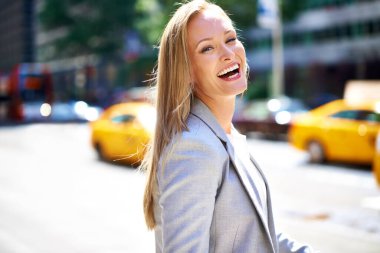 Walk the streets in style. A cropped shot of a beautiful woman walking around the city in the day time clipart