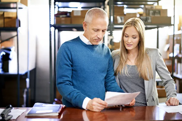 Lets Check Status Order Two Managers Looking Paperwork Warehouse Floor — Stock Photo, Image
