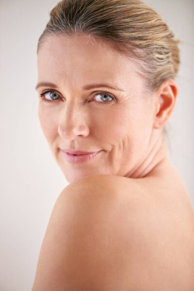 Love the skin youre in. Cropped portrait of an attractive mature woman posing in studio