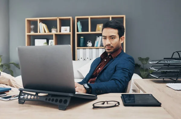 Business, man and laptop for digital planning, thinking or typing for ideas, data analytics or search internet. Male employee, entrepreneur or manager with device, concentration or research in office.