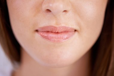 Taking care of her teeth. Closeup shot of a womans mouth clipart