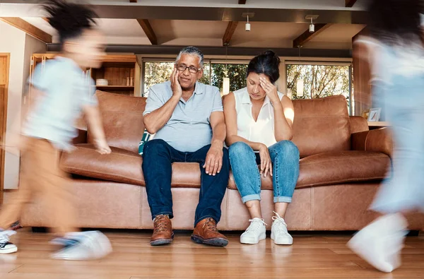 Kids Running Stress Grandparents Couch Tired Chaos Living Room Frustrated — Stock Photo, Image