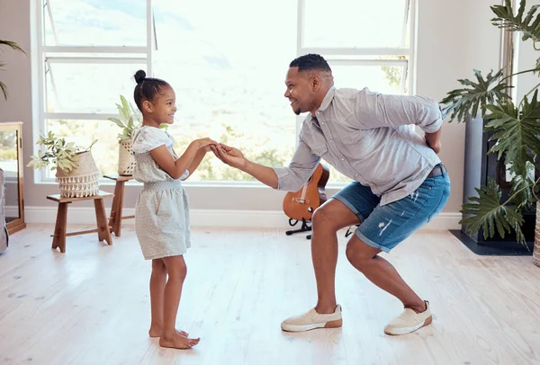 Dad, daughter and dance in home together on floor with love, bonding and care with smile in happy family. Black family, dancer father and girl child in living room for dancing, movement and happiness.