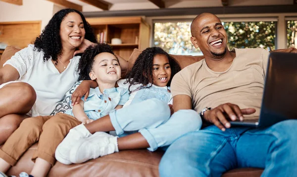 Laptop, happy family and kids with online video, movies or cartoon on couch on live streaming service, learning or bonding. Biracial mom, father and children watch film or show on computer and sofa.