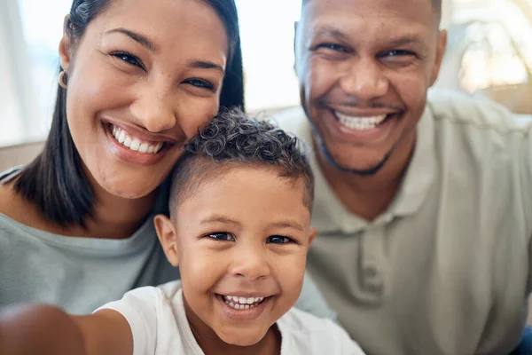 stock image Mother, father and child in a selfie or portrait in the house living room bonding and enjoying holidays as a family. Mama, dad and happy young boy kid or boy with a big smile loves pictures in Mexico.