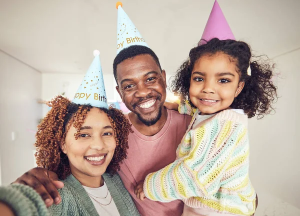Black family, selfie smile and birthday portrait in home and having fun at party celebration. Interracial, love and father, mother and child or girl taking pictures for happy memory and social media