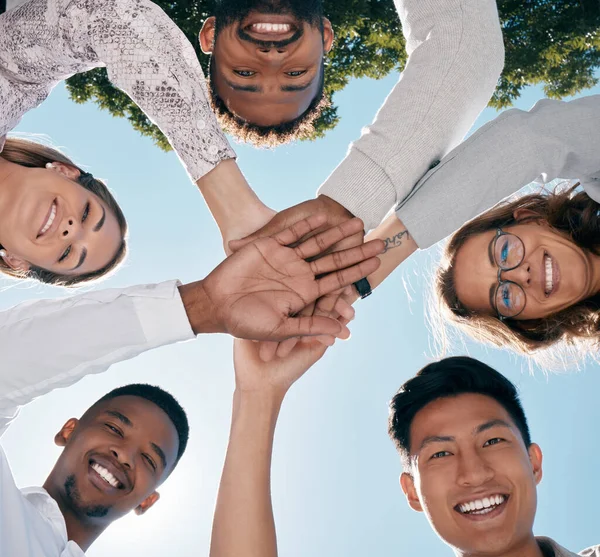 Team hands, face and happy employee support for business success, diversity solidarity and collaboration outdoor. Teamwork, interracial employees and team building holding hands together for goals.
