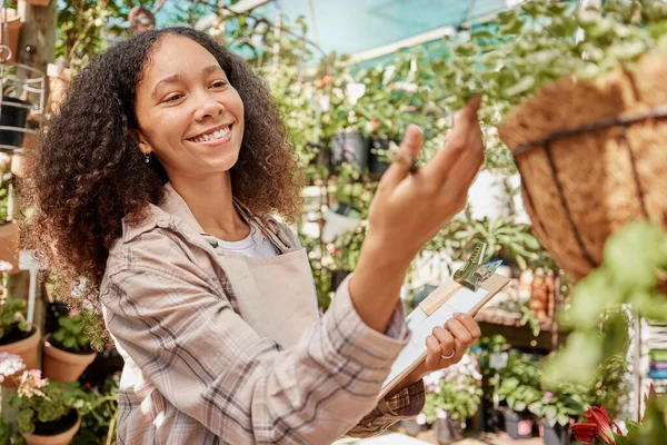 stock image Plant, nursery and woman worker with checklist doing quality assurance on farming stock. Sustainability, small business and growth, happy florist startup manager in commercial garden checking plants