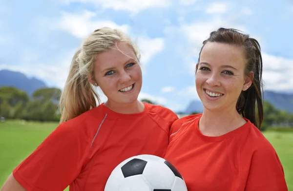 stock image Best forwards in the league. Portrait of two young female soccer players standing on a soccer field