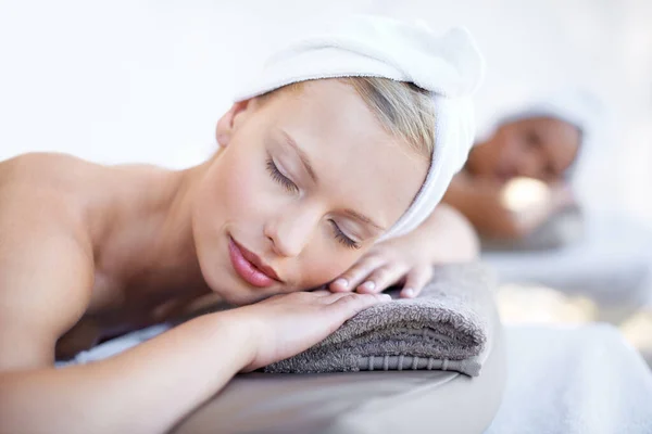 Theres nothing better than a day at the spa. A beautiful young woman relaxing at the beauty spa