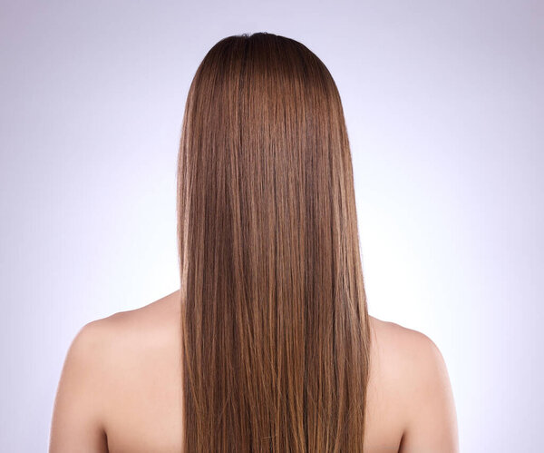 Beauty, back and haircare of woman in studio isolated on a gray background. Texture, cosmetics and female model with salon treatment for healthy keratin, balayage or hairstyle growth or straight hair.