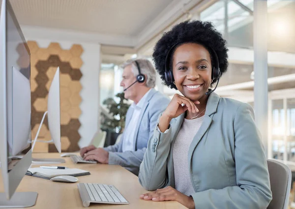 stock image Help desk, smile and portrait of confident black woman at computer with headset at call center. Customer service consultant at online crm office, leader at advisory agency with diversity and success