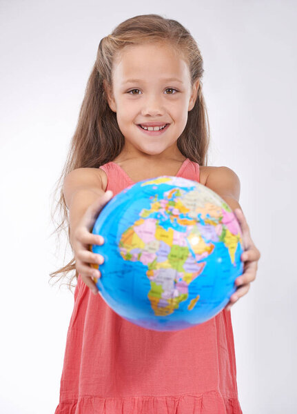 Save the planet for the next generation. Portrait of a sweet little girl holding a globe