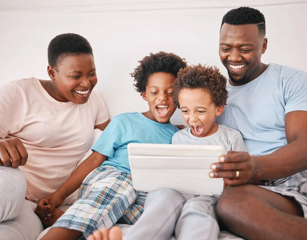 Black family, tablet and excited kid game of a mother, dad and children in a home at morning. Digital app, online and child gaming app with a mama, boys and father together with laughing in house.