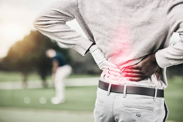 Sports, injury and golf, black man with back pain during game on course, massage and relief in health and wellness. Green, hands on spine for support and golfer with body ache during golfing workout