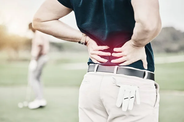 Sports, injury and man on golf course with back pain during game, massage and relief in health and wellness. Green, hands on spine in support and golfer with body ache at golfing workout on grass