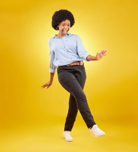 Dance, excited and happy black woman on yellow background with motivation, dancing and smile. Winner mockup, wow portrait and isolated full body of girl for freedom, winning and success in studio.