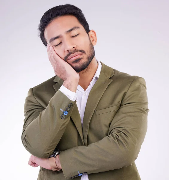 Tired, bored and Asian man sleeping for rest isolated on a white background in a studio. Dream, young and a Japanese businessman with fatigue, exhausted and sleep for stress relief on a backdrop.