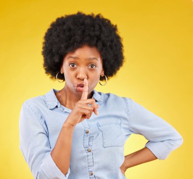 Privacy, secret and finger on lips of black woman in studio for mystery, gossip and announcement. Noise, news and whisper with female and shush gesture on yellow background for rumor, drama or silent. clipart