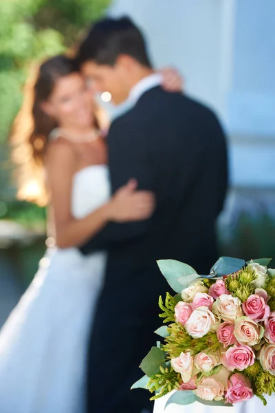 Flowers Reception Embracing Newlyweds Focus Bouquet Foreground — Stock Photo, Image