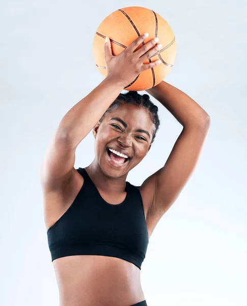 stock image Im about that action. Studio shot of a sporty young woman posing with a basketball against a studio background