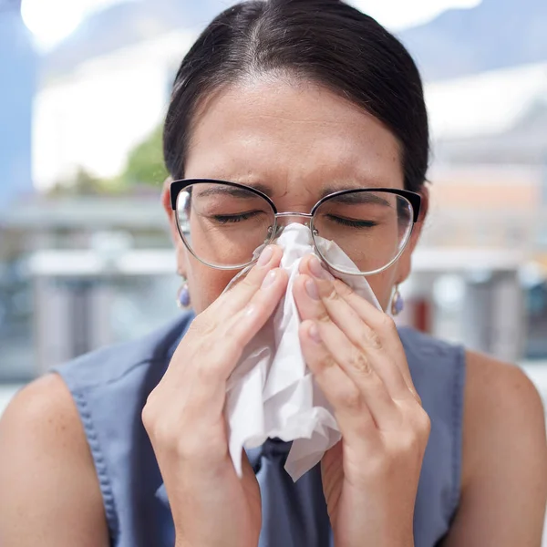 Entrepreneur, flu and woman with tissue, allergy and manager with glasses, sickness and safety. Female employee, business owner and administrator with toilet paper, blowing nose or fever in workplace.