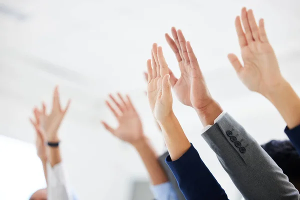 Closeup of unknown group of diverse businesspeople celebrating success after interview. Team of applicants together with arms raised. Candidates selected for job opening, vacancy, office opportunity.