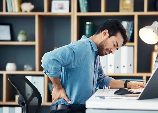 Back pain, business man and office stress of muscle injury, health risk and backache on desk chair. Uncomfortable worker, spine problem and posture of body, scoliosis and fatigue of corporate burnout.