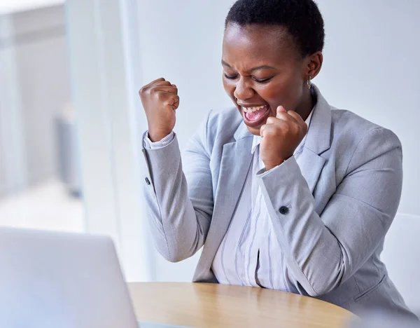 stock image This has been the best day. a young businesswoman cheering at work