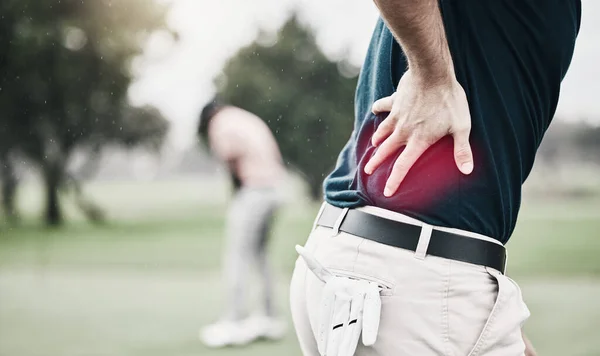 Sports, injury and golf, man with back pain during game on course, massage and relief in health and wellness. Green, hands on spine in support and golfer with body ache during outdoor golfing workout.