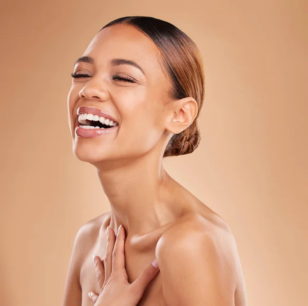 Happy, beauty and a woman laughing for skin glow and shine in studio on a brown background. Face of aesthetic female model satisfied with spa facial, dermatology cosmetics and wellness with skincare.