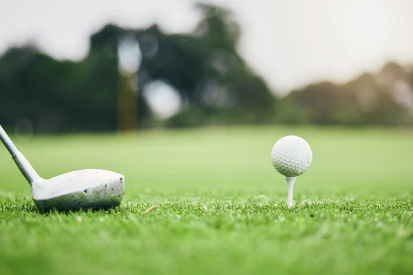 Sports, golf ball and tee on course with club for competition match, tournament and training. Target, challenge and games with equipment on grass field for leisure, recreation hobby and practice.