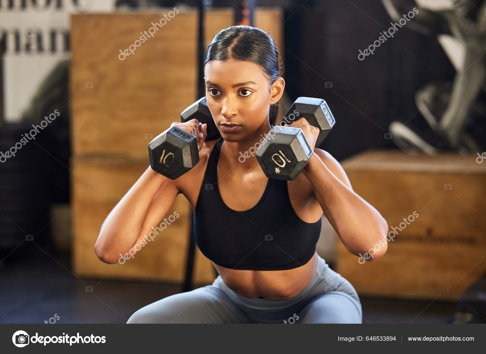 Show Those Dumbbells Whos Boss Young Woman Working Out Weights Stock Photo PeopleImages 646533894