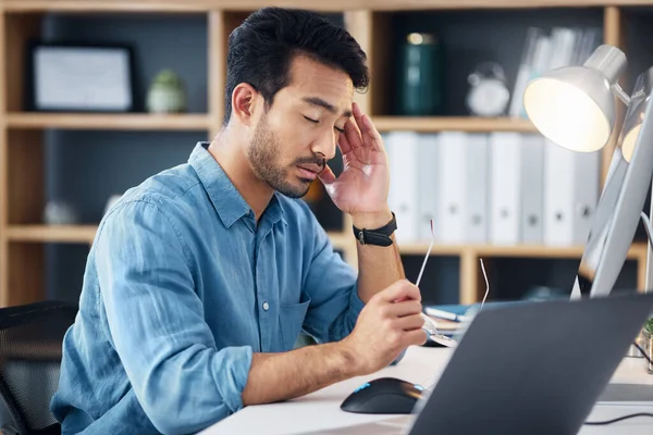 Burnout, headache and tired man on computer with career stress, anxiety or mental health risk in office. Sad business man with depression, migraine and trouble for online job mistake, fail or fatigue.
