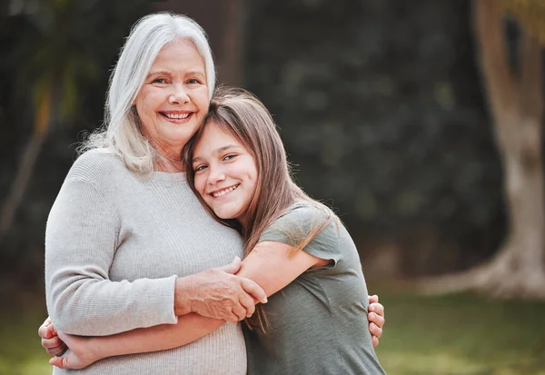 Granddaughter Sweetest Child Young Girl Embracing Her Grandmother While Standing — Stock Photo, Image