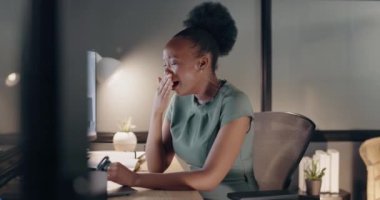 Black business woman, stress and burnout at night while tired and working on a computer at a office desk with a headache. Female entrepreneur with anxiety and frustrated about online work problem.