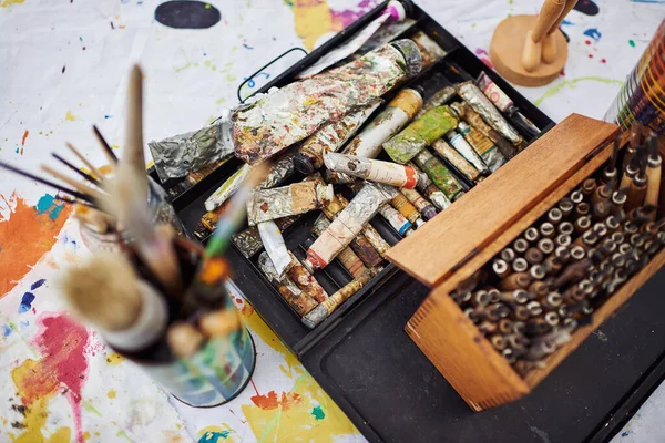 You have everything you need to start creating. Still life shot of art supplies lying on the floor