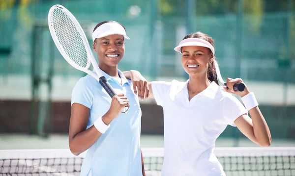 Sports, portrait and tennis team of women at court for training, workout or cardio fitness, happy and bonding. Face, friends and players outdoors for health, match and athletic exercise together.