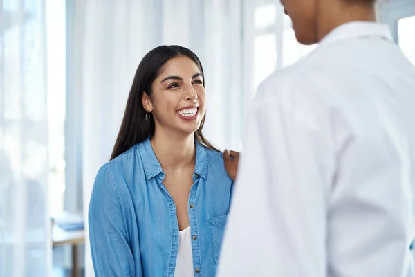 stock image Happy patients are healthy patients. a young woman having a consultation with her doctor