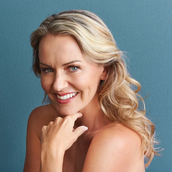 stock image Worrying only brings more wrinkles. Studio portrait of an attractive mature woman posing against a grey background