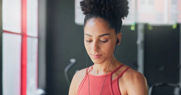 Black woman, breathe and earphones for music with fitness and exercise ready in gym, health and active motivation. Start, workout and calm for body training and endurance, wellness and listening
