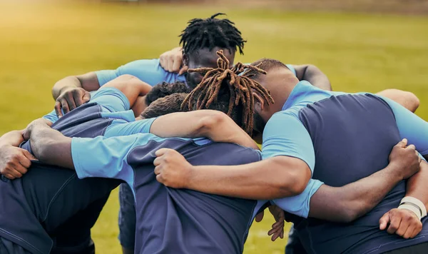 Diversity, team and men huddle in sports for support, motivation or goals outdoors. Man sport group and rugby scrum together for fitness, teamwork or success in collaboration before match or game.