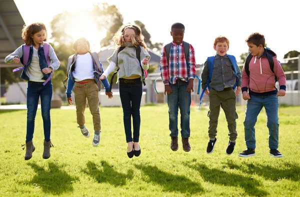 Doing What Kids Best Jumping Joy Young Kids Playing Together — Stock Photo, Image