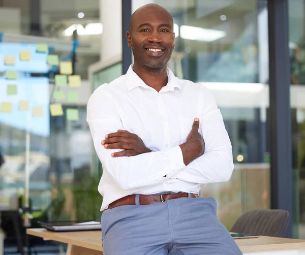 Portrait, business smile and black man with arms crossed in office with pride for career, job or occupation. Ceo, boss and happy, proud and confident male entrepreneur from Kenya with success mindset.