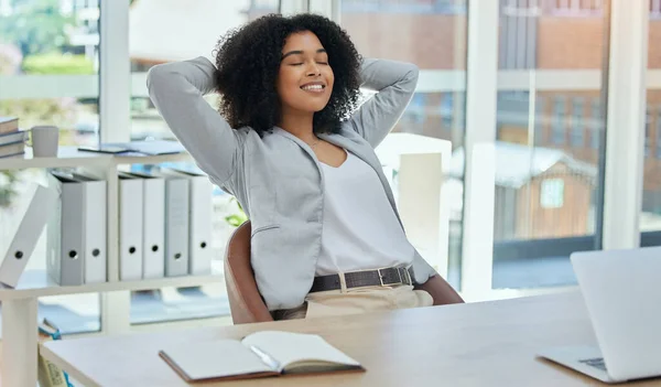 Happy business woman stretching at desk for relax, career success and work life balance in her office. Professional worker or biracial person calm, confident and peace for project time management.