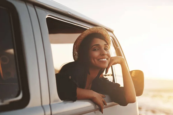 Kicking off summer with a relaxing road trip. an attractive young woman enjoying a road trip